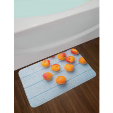 Apricots on Blue Wooden Table Bath Mat