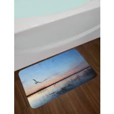 Geese Flying Across Wild Lake Bath Mat