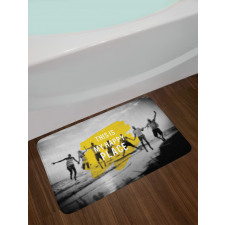 Jumping People on Beach Blur Bath Mat