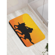 Silhouette of a Lone Rider Bath Mat