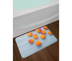 Apricots on Blue Wooden Table Bath Mat