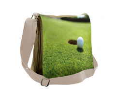 Golf Ball on Lip of Cup Grass Messenger Bag