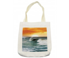 Sunset over Wavy Ocean Tote Bag