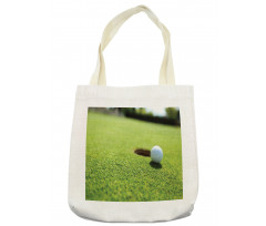 Golf Ball on Lip of Cup Grass Tote Bag