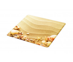 Various Seashells on Sand Cutting Board