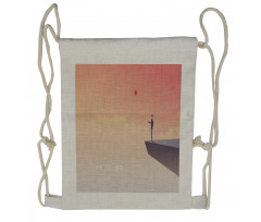 Man Standing on a Cliff Drawstring Backpack