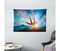 Man Jumping over Rocks Wide Tapestry