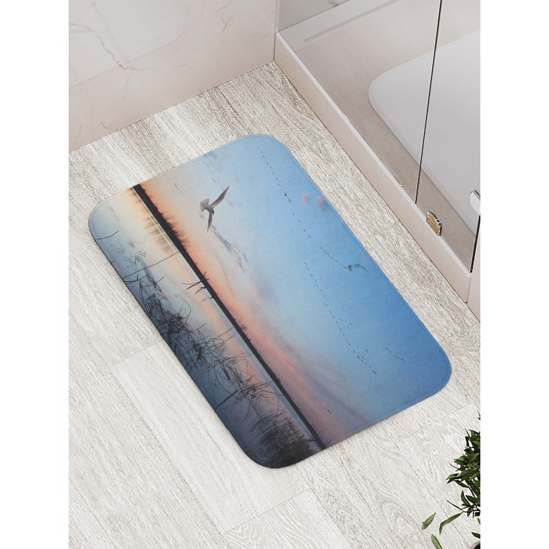 Geese Flying Across Wild Lake Bath Mat