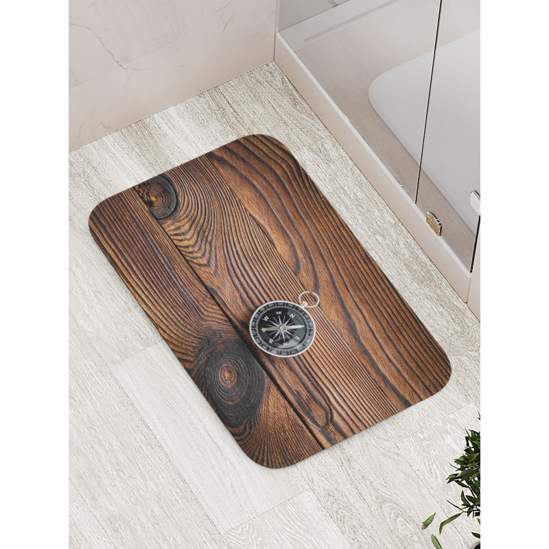 Navigator Tool on Wooden Bath Mat