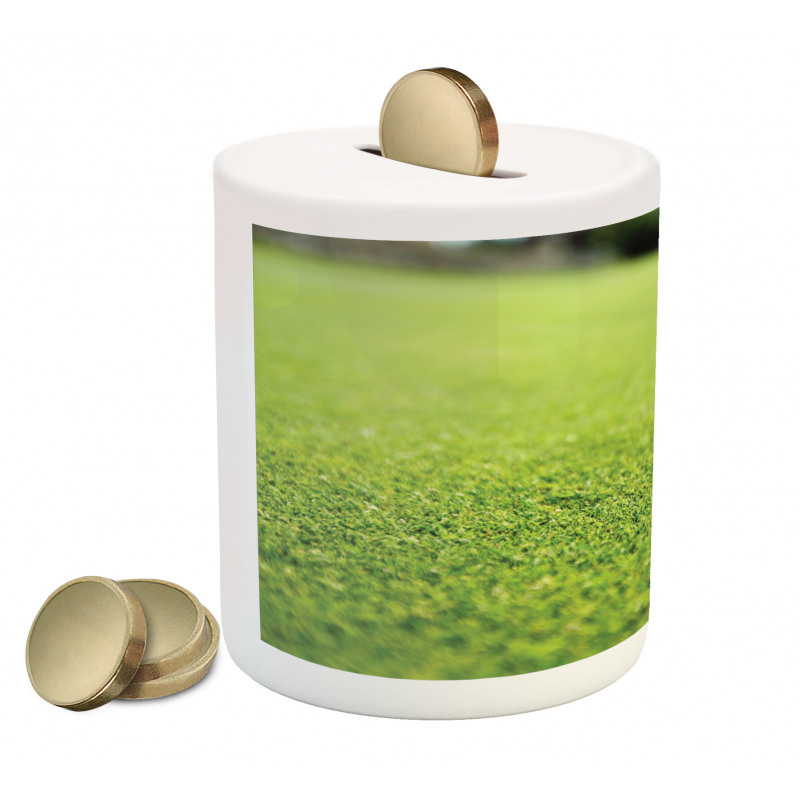 Golf Ball on Lip of Cup Grass Piggy Bank